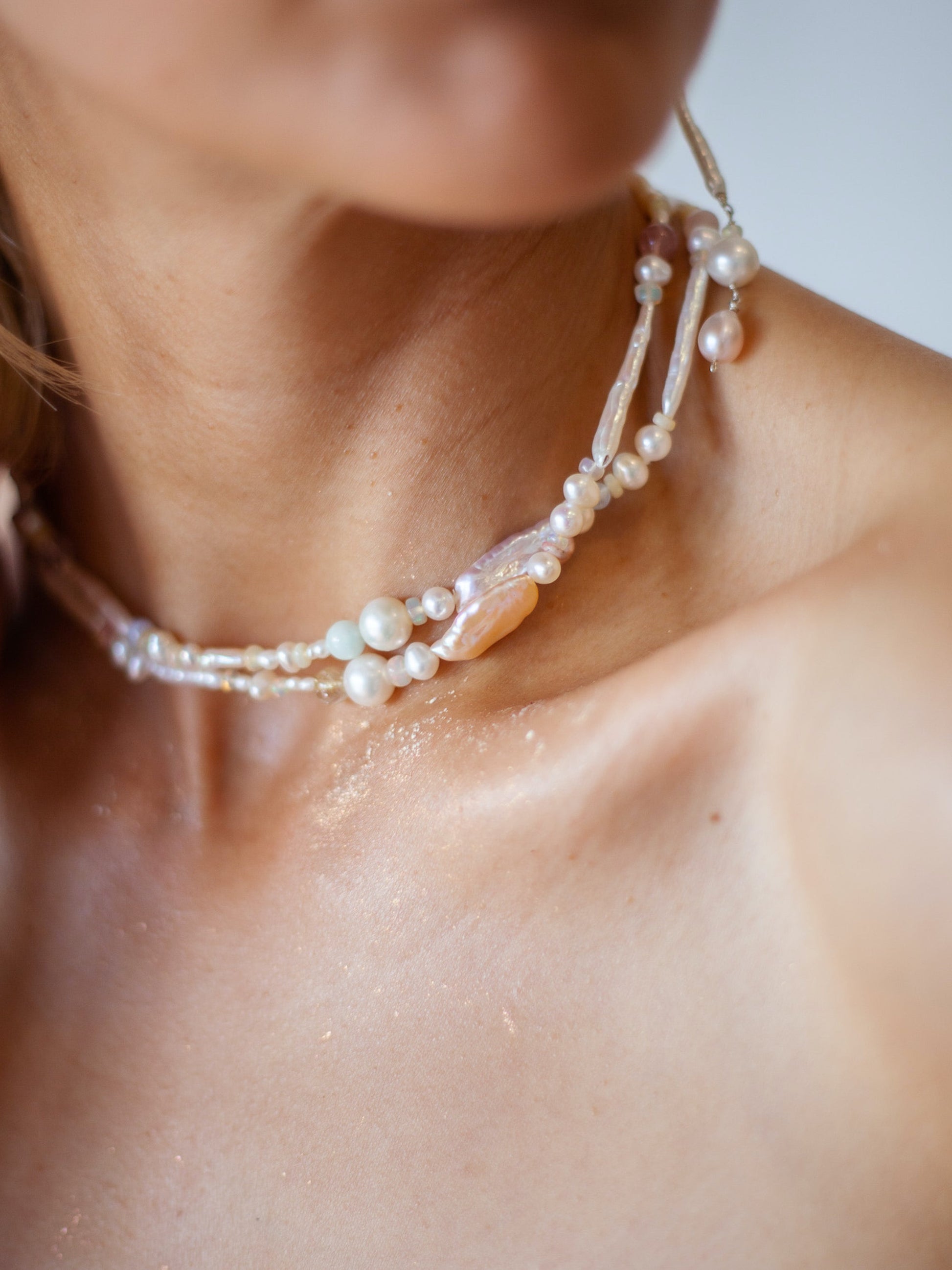 Candy Pearl & Multi-stone Necklace - Glistening in candy colours, and finished with 14 karat Gold hardware, this necklace is absolutely gorgeous. Hand crafted with a variety of Violet Keshi Pearls, South Sea Pearls, Biwa Pearls, Freshwater Pearls & Pink Freshwater Pearls. Combined with a glittery cluster of Australian Opals, Aquamarine, Blue Lace Agate, Jade, and the ultimate - The Super Seven Stone. Designed and made by nāmaka