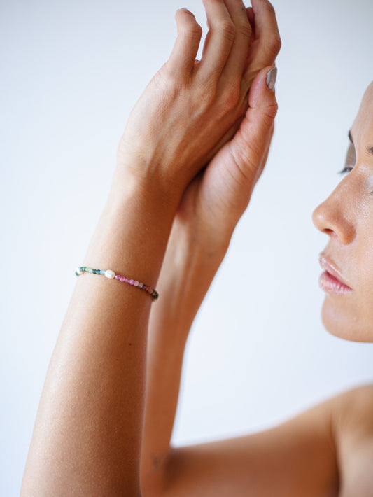Nāmaka Tourmaline & Pearl Bracelet - Each tourmaline gem, with unique colours and patterns, sparkle and catch the eye. Teamed with a scattering of freshwater pearls highlight the piece.  This bracelet is both casual yet elegant, and can be teamed with matching earrings and necklace.  Designed & handcrafted by Nāmaka in Melbourne Australia