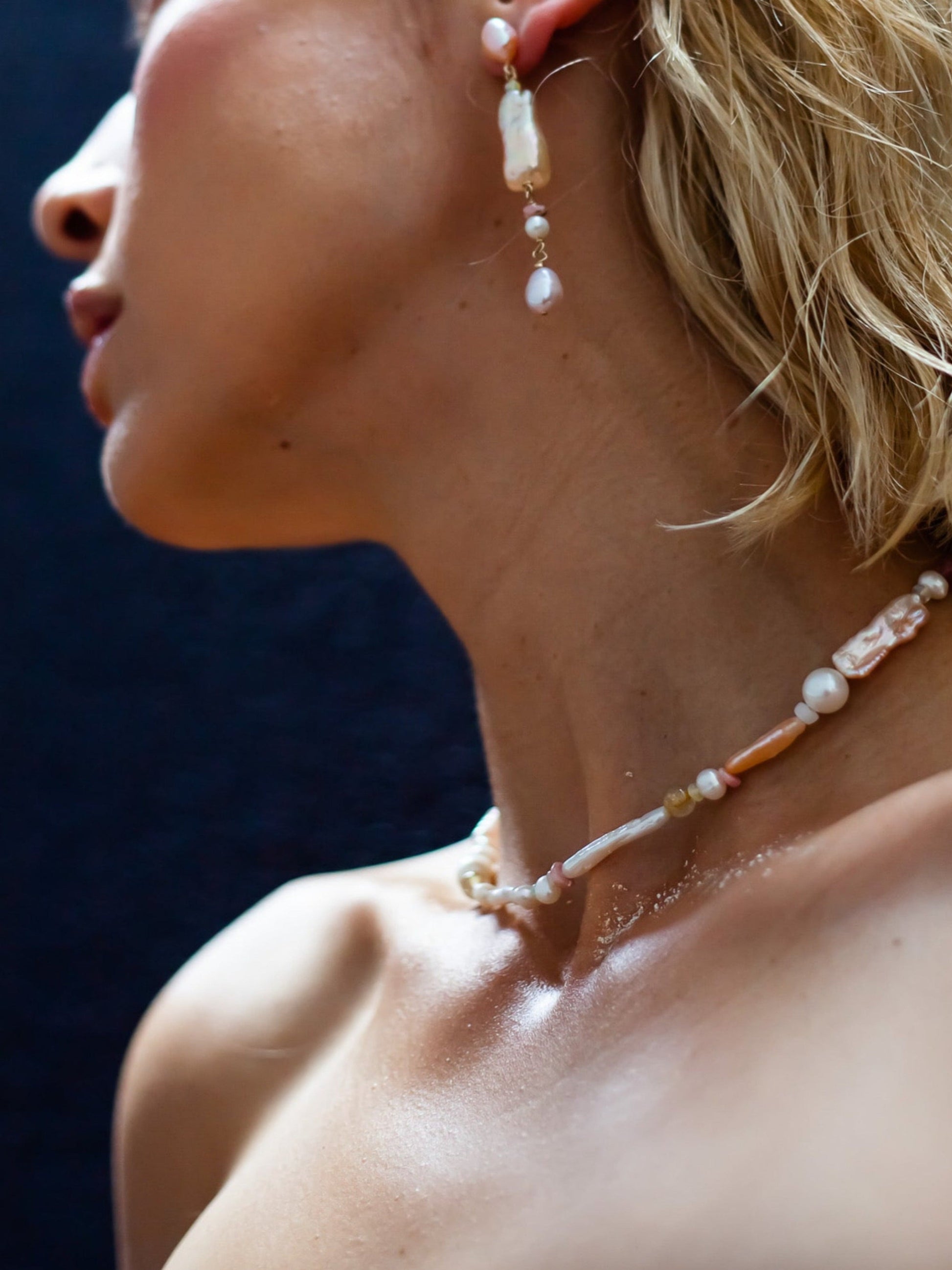 Peach Candy Pearl & Opal Necklace - Glistening in peachy pastel candy colours, and finished with 14 karat Gold hardware, this necklace is absolutely gorgeous. Hand crafted with a variety of Peach and apricot hued Keshi Pearls, Estate re-purposed Akoya Pearls, Biwa Pearls, Freshwater Pearls & Pink Freshwater Pearls. Combined with a glittery cluster of Australian Opals, Pink Lace Agate, and the ultimate - The Super Seven Stone.  Designed and personally handcrafted by nāmaka