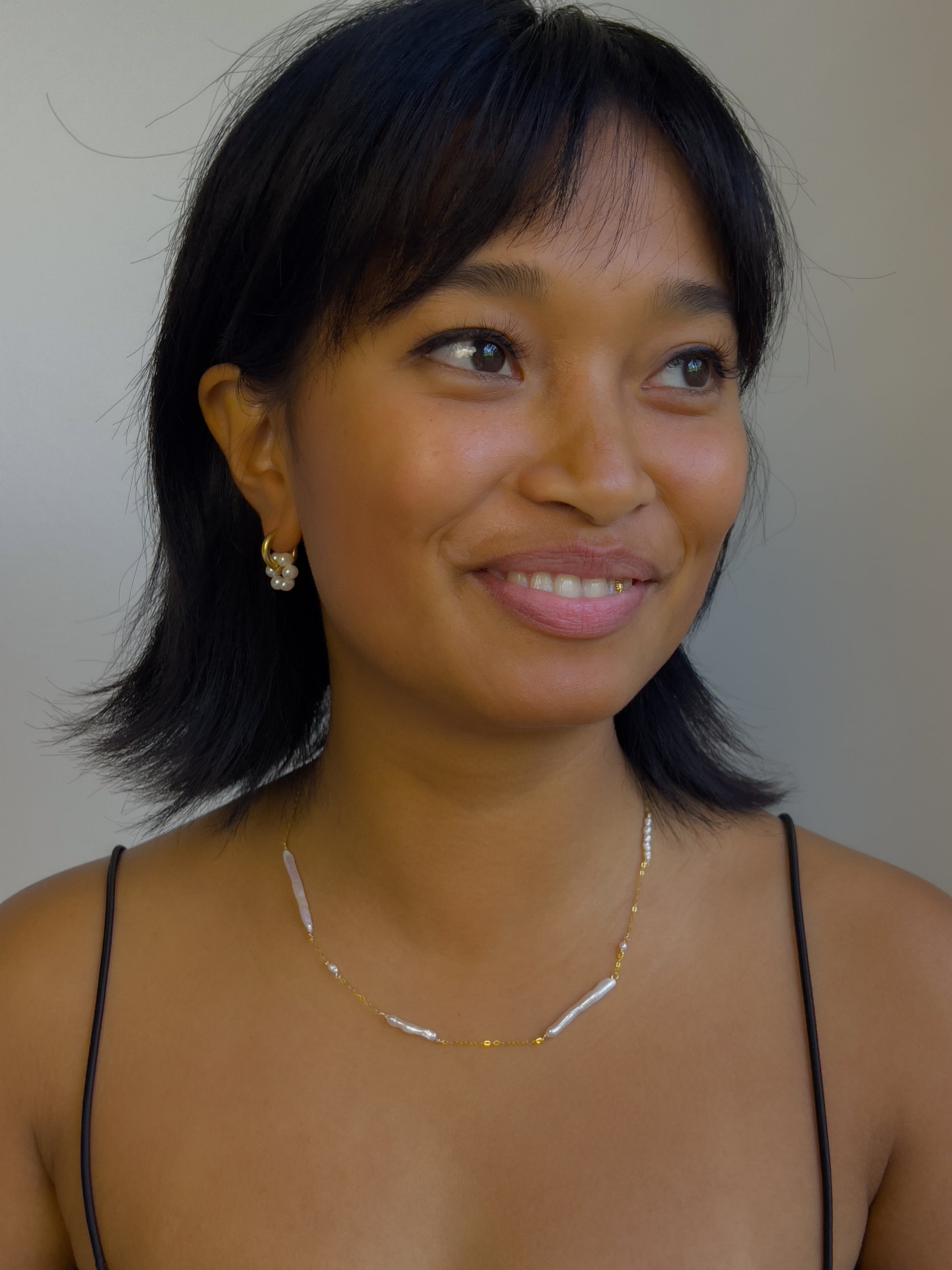 Biwa pearl gold necklace. This ultra fine 14 karat Gold filled with sterling silver flat cable chain suspends gorgeous Biwa elongated freshwater pearls and freshwater seed pearls. Designed and made by nāmaka.