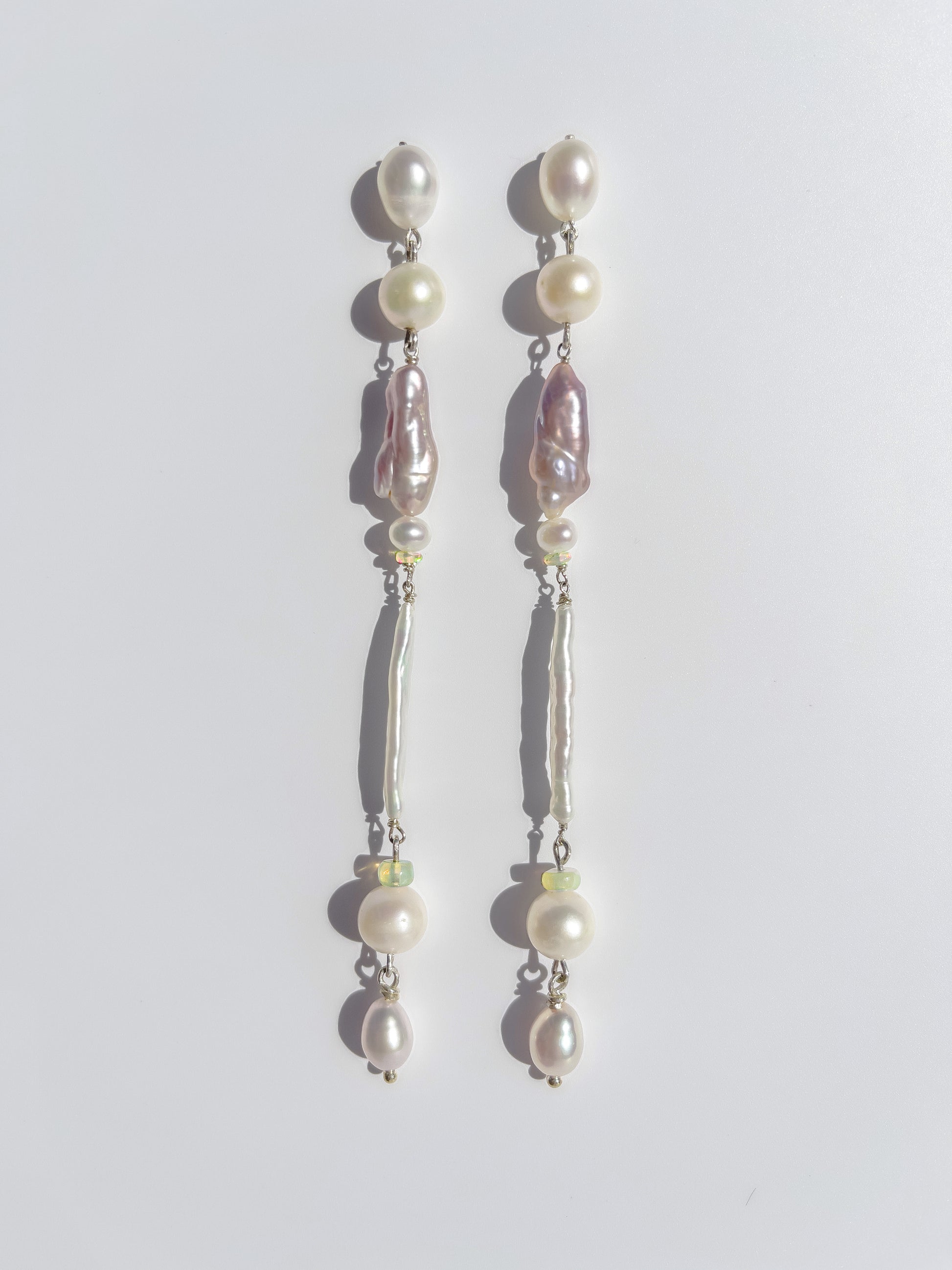 Candy Pearl & Opal Drop Earrings - These earrings are an absolute showstopper. Hand crafted using Sterling Silver, which suspend a combination of Violet Keshi Pearls, South Sea Pearls, Opals, Biwa Pearls, Freshwater Pearls and Luxe Violet teardrop pearls. These earrings glisten in candy colours, and are uniquely gorgeous in every way.