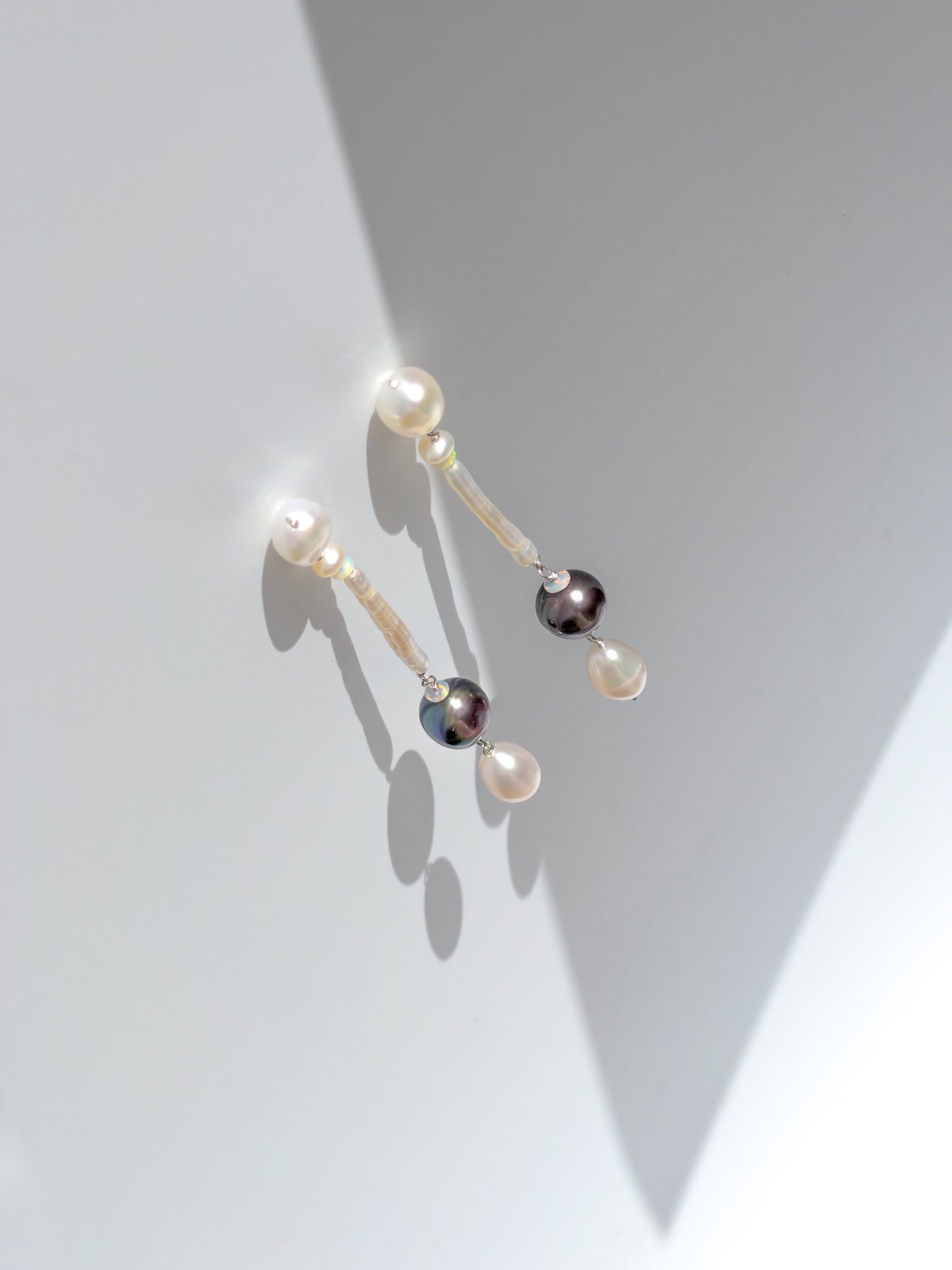 Nāmaka Tahitian Black Pearl & Opal Drop Earrings - These earrings are an absolute showstopper. Hand crafted using Sterling Silver, which suspend a combination of Estate Repurposed Tahitian Black Pearls, Opals, Biwa Pearls, Freshwater Pearls. Finished with Estate Repurposed Violet teardrop AAA pearls. These Nāmaka earrings glisten in candy colours, and are uniquely gorgeous in every way.  Designed & personally handcrafted by Nāmaka in Melbourne Australia       
