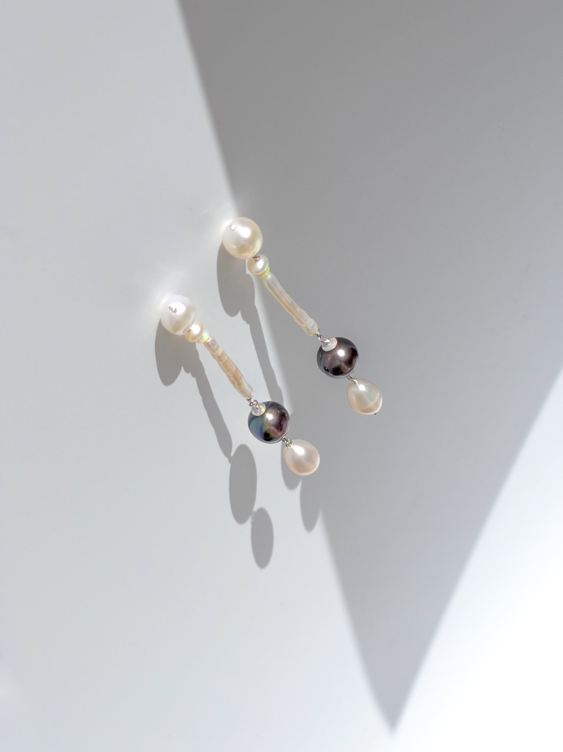 Nāmaka Tahitian Black Pearl & Opal Drop Earrings - These earrings are an absolute showstopper. Hand crafted using Sterling Silver, which suspend a combination of Estate Repurposed Tahitian Black Pearls, Opals, Biwa Pearls, Freshwater Pearls. Finished with Estate Repurposed Violet teardrop AAA pearls. These Nāmaka earrings glisten in candy colours, and are uniquely gorgeous in every way.  Designed & personally handcrafted by Nāmaka in Melbourne Australia       
